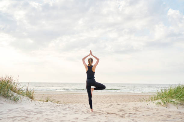 Browse Free HD Images of Beach Yoga Pose- In Sand At Sunset